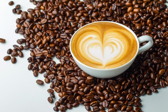 Latte art, coffee in coffee beans background